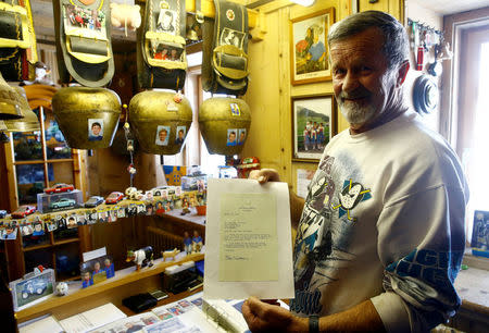 Hans Stiffler displays a personal letter from former U.S. President Bill Clinton thanking him for helping his staff during the 2000 World Economic Forum (WEF) in the Swiss mountain resort of Davos, Switzerland, January 11, 2018 REUTERS/Arnd Wiegmann