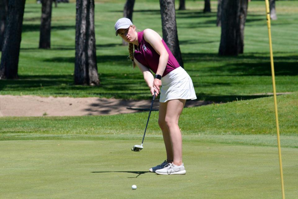 Albany's Abby Thelen finds her line and putts her ball during a golf match at Wapicada Golf Club in Sauk Rapids on Tuesday, May 25, 2021. 