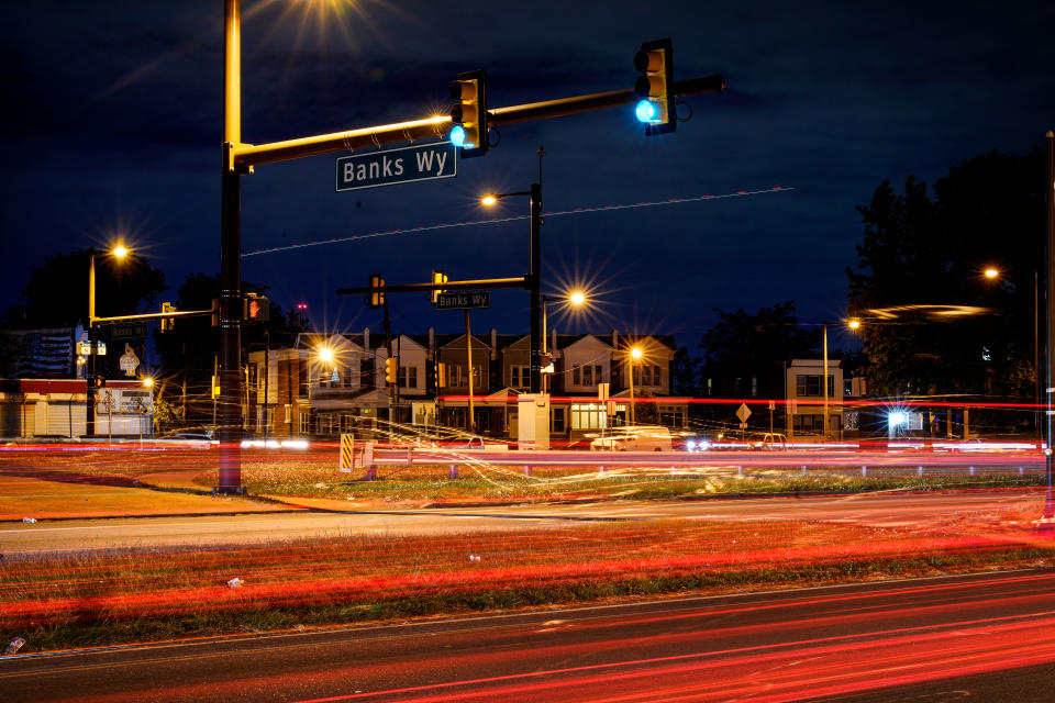 This long exposure photo shows traffic driving on Roosevelt Boulevard at Banks Way, named for Samara Banks and her three children who were struck and killed by a car in 2013, in Philadelphia, Wednesday, May 25, 2022. (AP Photo/Matt Rourke)