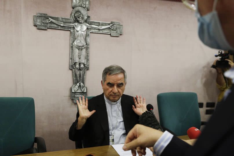 Cardinal Angelo Becciu talks to journalists during press conference in Rome in 2020