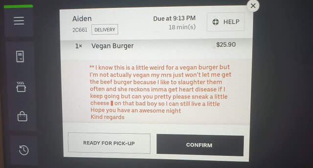 A message from a customer for a vegan burger is seen on a computer screen.