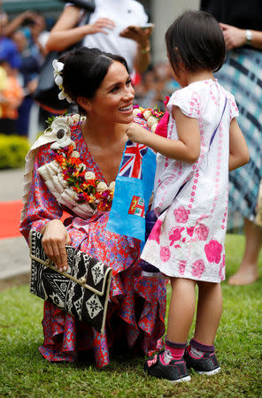Meghan, Duchess of Sussex, speaks to Natasha Manuela, 3, during a visit the University of the South Pacific in Suva, Fiji, October 24, 2018. REUTERS/Phil Noble/Pool