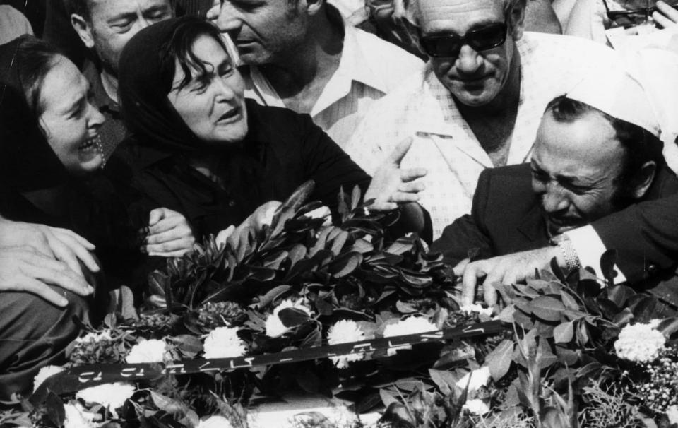 People weep over the coffins of the 11 Israeli Olympic team members who were killed in a terrorist attack at the 1972 Games - Hulton Archive