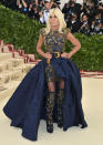 <p>Donatella went with a standout skirt over-top a dress from Versace, of course. (Photo: Getty Images) </p>