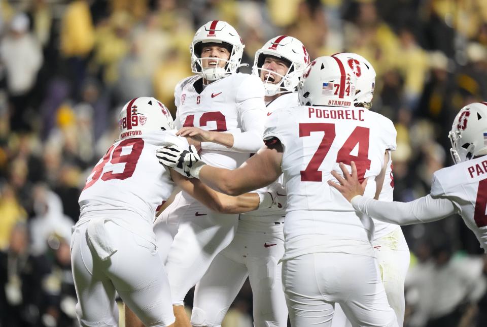 Oct 13, 2023; Boulder, Colorado, USA; Stanford Cardinal place kicker Joshua Karty (43) (center) and (15) punter Connor Weselman (15) and tight end Lukas Ungar (89) and Stanford Cardinal offensive lineman James Pogorelc (74) celebrates defeating the Colorado Buffaloes in double overtime at Folsom Field.