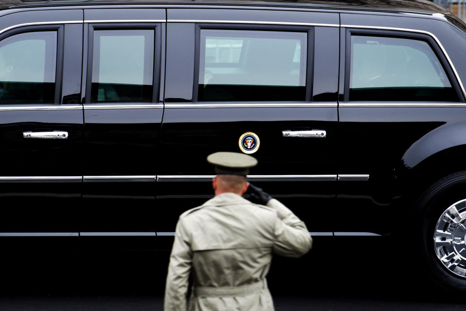 <p>A member of the Army salutes as the Presidential motorcade drives on Pennsylvania Avenue to the Capitol for the Inauguration of President-elect Donald Trump in Washington, Friday, Jan. 20, 2017. (Photo: Cliff Owen/AP) </p>