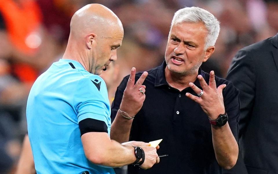 Roma manager Jose Mourinho exchanges words with referee Anthony Taylor during the UEFA Europa League Final at the Puskas Arena, Budapest. - PA/Adam Davy