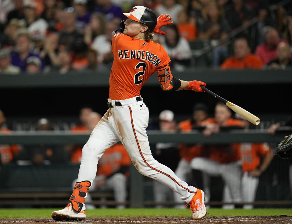 FILE - Baltimore Orioles' Gunnar Henderson follows through while hitting a two-run home run to score Adam Frazier in the second inning of a baseball game against the Tampa Bay Rays, Sept. 16, 2023, in Baltimore. The Orioles won 101 games last season before getting swept out of the playoffs by the eventual champion Rangers. AL Rookie of the Year Henderson returns after blasting 28 home runs and playing great defense at both shorstop and third. (AP Photo/Julio Cortez, File)