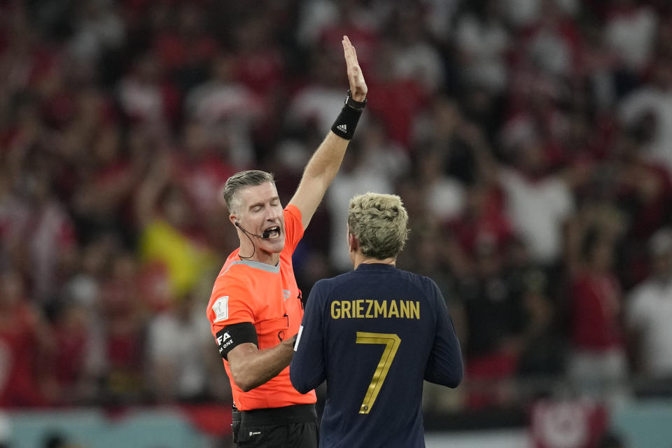 Referee Matthew Conger signals to France's Antoine Griezmann that his goal is disallowed during the World Cup group D soccer match between Tunisia and France at the Education City Stadium in Al Rayyan , Qatar, Wednesday, Nov. 30, 2022. (AP Photo/Christophe Ena)