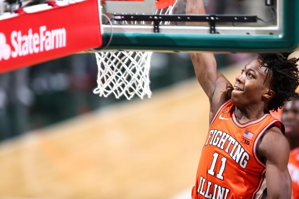 Ayo Dosunmu of the Illinois Fighting Illini dunks the ball during the game against the Michigan State Spartans.