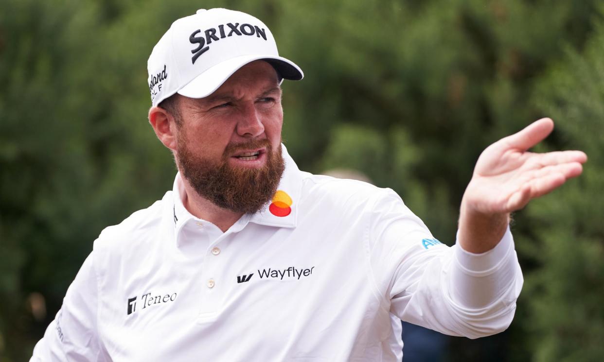 <span>Shane Lowry reacts after being distracted by a camera operator on the 11th hole at Royal Troon.</span><span>Photograph: Pedro Salado/Getty Images</span>