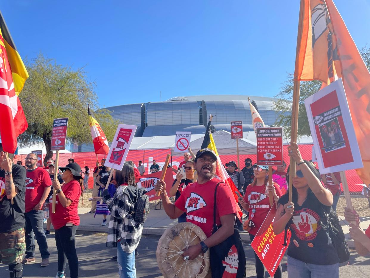 About 50 protesters gathered outside State Farm Stadium on Feb. 12, 2023, calling for the Kansas City Chiefs to reevaluate the team's logo and name.