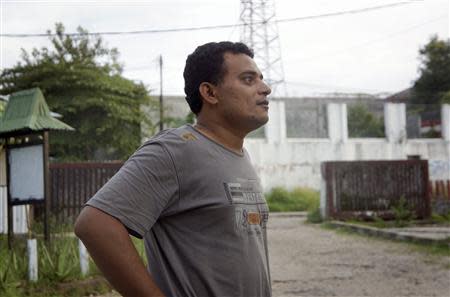 Bakil Abdul Hamid, a Yemeni asylum seeker, stands in an immigration holding area at a hotel in Kupang January 28, 2014. REUTERS/Aubrey Belford