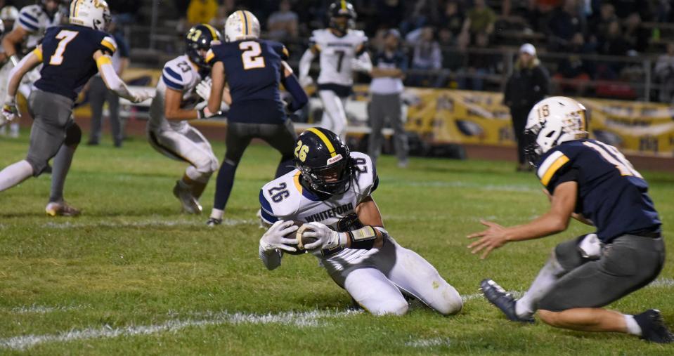 Jake Iott of Whiteford recovers a fumble. He was the Monroe County Region tackles leader for the 2023 season.