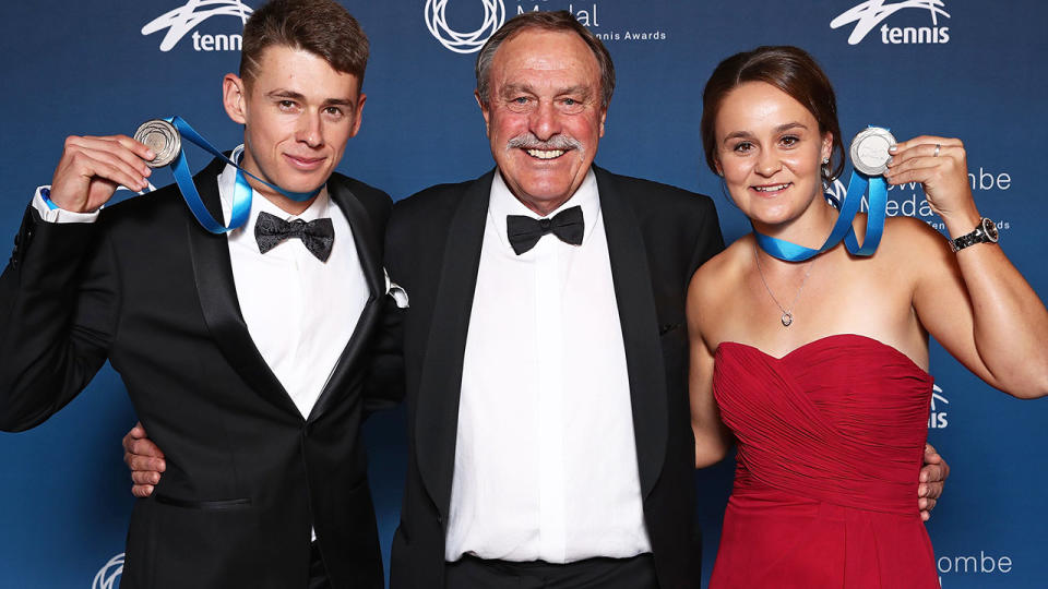 Alex de Minaur and Ashleigh Barty pose with John Newcombe and their medals. (Photo by Scott Barbour/Getty Images)