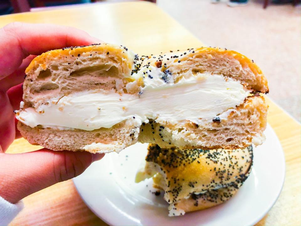 A poppyseed bagel with cream cheese from Katz's Delicatessen.