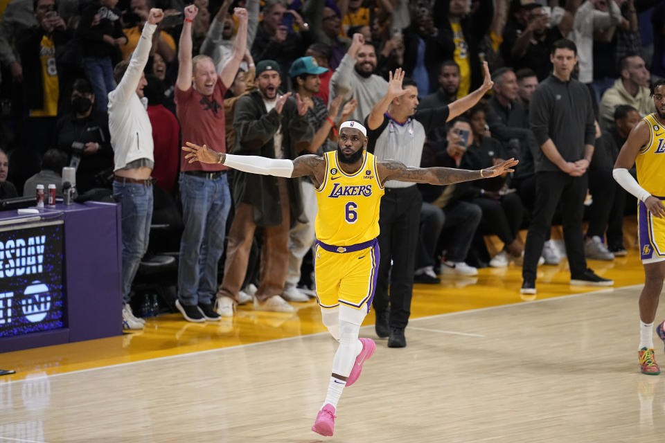 Los Angeles Lakers forward LeBron James celebrates after scoring to pass Kareem Abdul-Jabbar to become the NBA's all-time leading scorer during the second half of an NBA basketball game against the Oklahoma City Thunder Tuesday, Feb. 7, 2023, in Los Angeles. (AP Photo/Mark J. Terrill)