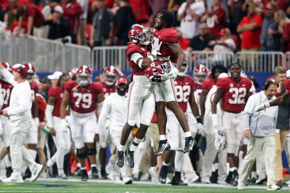 Alabama Crimson Tide defensive back Jordan Battle (9) celebrates with tight end Jahleel Billingsley (19) after an interception return for a touchdown against the Georgia Bulldogs in the second half during the SEC championship game.