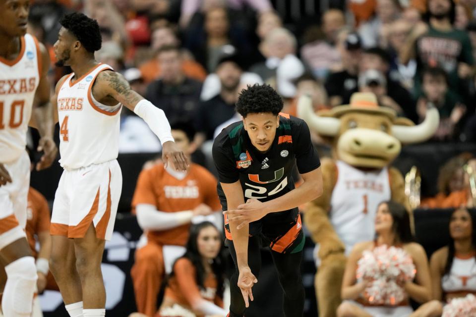 Miami guard Nijel Pack celebrates after scoring against Texas in the first half of an Elite 8 college basketball game in the Midwest Regional of the NCAA Tournament Sunday, March 26, 2023, in Kansas City, Mo. (AP Photo/Charlie Riedel)
