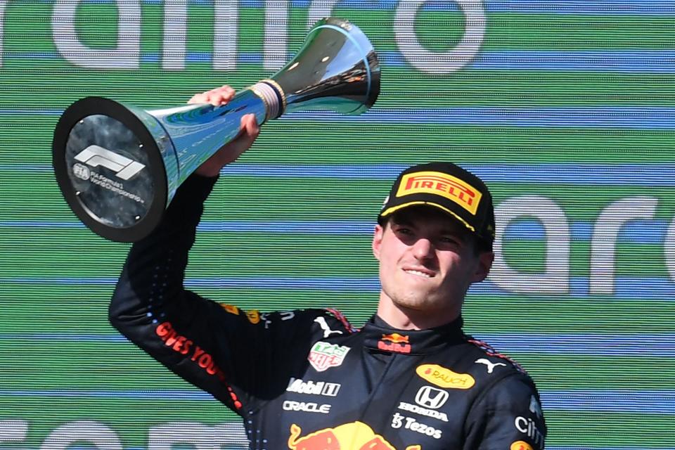 Red Bull's Dutch driver Max Verstappen celebrates on the podium winning the Formula One United States Grand Prix at the Circuit of The Americas in Austin, Texas