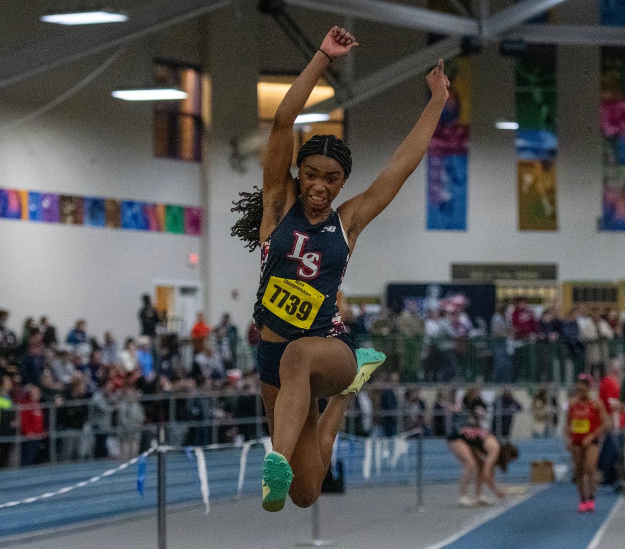 BOSTON - Lincoln-Sudbury’s Gabrielle Pierre jumps her way to a second place finish in the long jump during the indoor track and field championship Saturday at the Reggie Lewis Center.