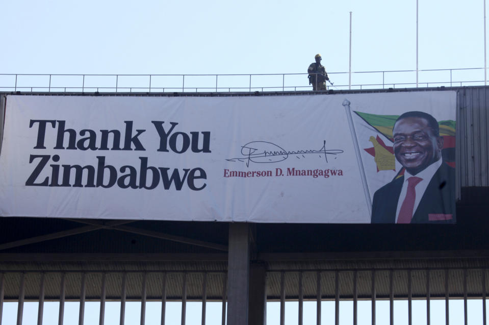 A soldier stands guard during the inauguration ceremony of Zimbabwean President Emmerson Mnangagwa, at the National Sports Stadium in Harare, Sunday, Aug. 26, 2018. Zimbabweans have begun arriving at a national stadium for the inauguration of President Emmerson Mnangagwa after a bitterly disputed election.(AP Photo/Tsvangirayi Mukwazhi)