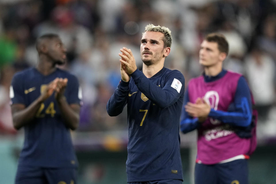 France's Antoine Griezmann applauds after the World Cup group D soccer match between Tunisia and France at the Education City Stadium in Al Rayyan , Qatar, Wednesday, Nov. 30, 2022. Defending champion France won its World Cup group despite losing to Tunisia 1-0. (AP Photo/Frank Augstein)