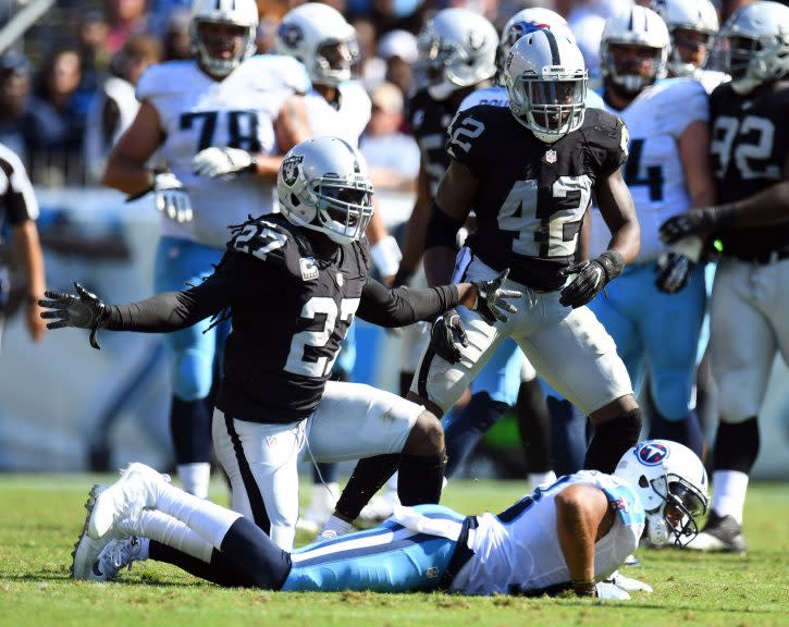 Sep 25, 2016; Nashville, TN, USA; Oakland Raiders safety Reggie Nelson (27) celebrates after breaking up a pass intended for Tennessee Titans receiver Rishard Matthews (18) during the second half at Nissan Stadium. The Raiders won 17-10. Mandatory Credit: Christopher Hanewinckel-USA TODAY Sports