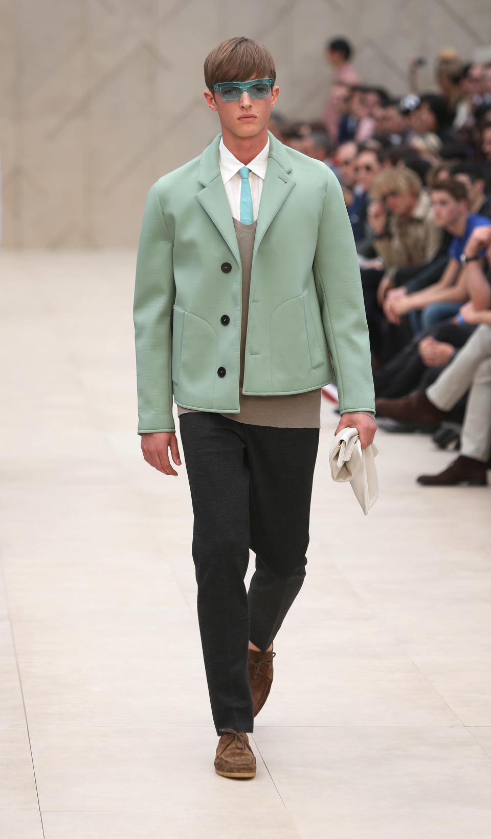 A model wears a creation for Burberry during London Men's spring summer fashion collections 2014, in London, Tuesday, June 18, 2013. (Photo by Joel Ryan/Invision/AP)
