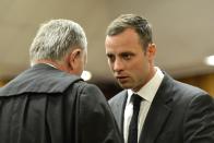 Oscar Pistorius arrives in court ahead of his trial at the North Gauteng High Court in Pretoria March 3, 2014. "Blade Runner" Pistorius arrived at the Pretoria High Court on Monday for the start of his murder trial, opening a decisive chapter in the story of the rise and fall of one of the world's best-known athletes. REUTERS/Herman Verwey/Pool (SOUTH AFRICA - Tags: SPORT CRIME LAW)