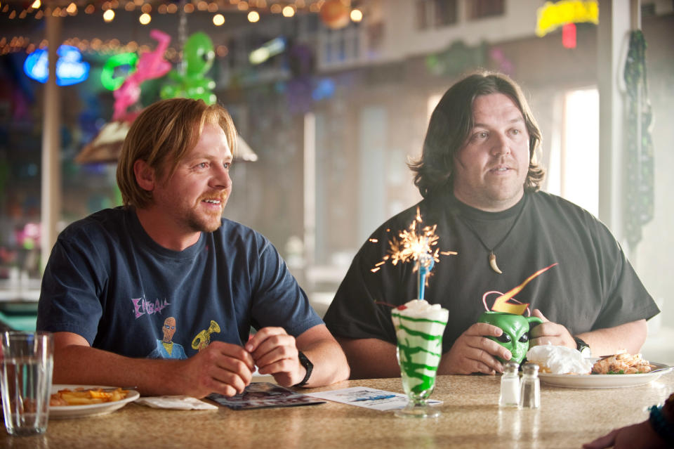 Graeme and Clive in a bar drinking something with a sparkler in it