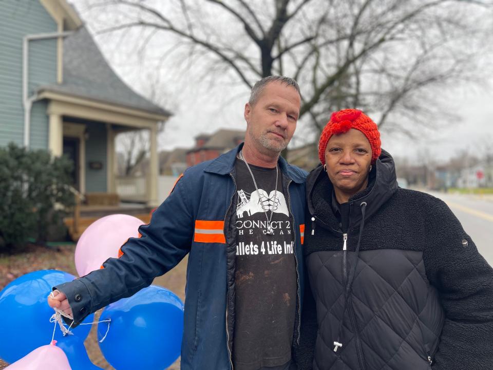 Todd Boginia (left) and Sheila Gaston (right) attend a balloon release on 222 LaPorte Ave., South Bend, honoring six child lives lost by fatal fire.