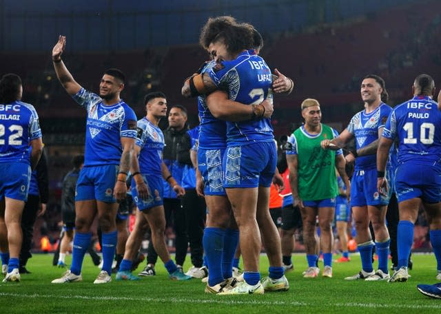 Samoa celebrate their victory over England