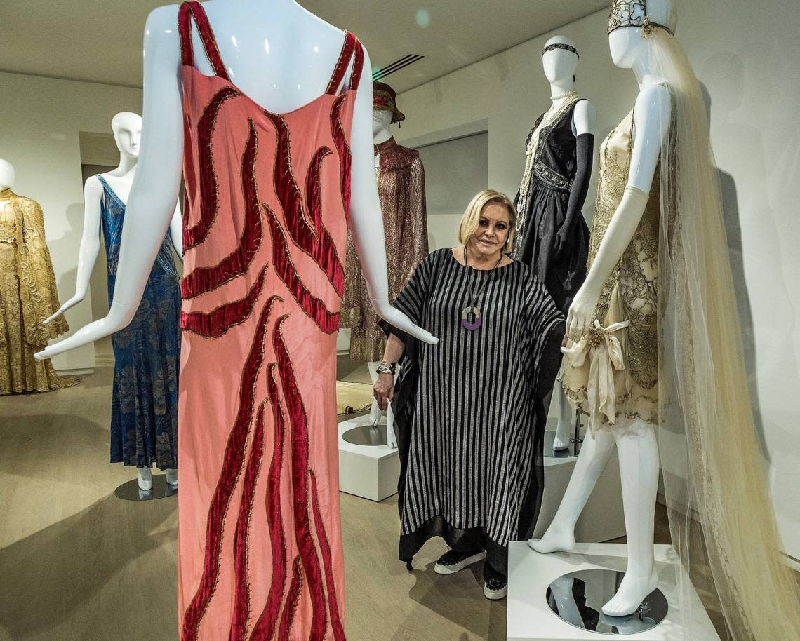 Paquita Parodi’s collection features costumes from the 1920s like the “Flame Dress” (left) in pink silk and red velvet, made in 1926 by the French couturier Madeleine Vionnet. Next to it, a wedding dress made in 1920 by the French designer Paul Poiret, in tulle and with gold thread embroidery. Pedro Portal/pportal@miamiherald.com