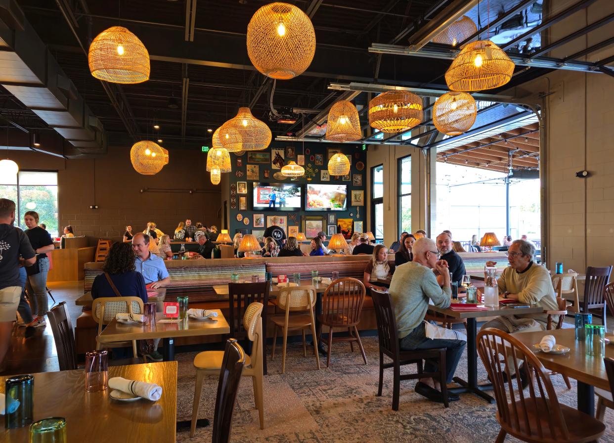 Garage doors roll up to the patio at Either/Or in Des Moines.