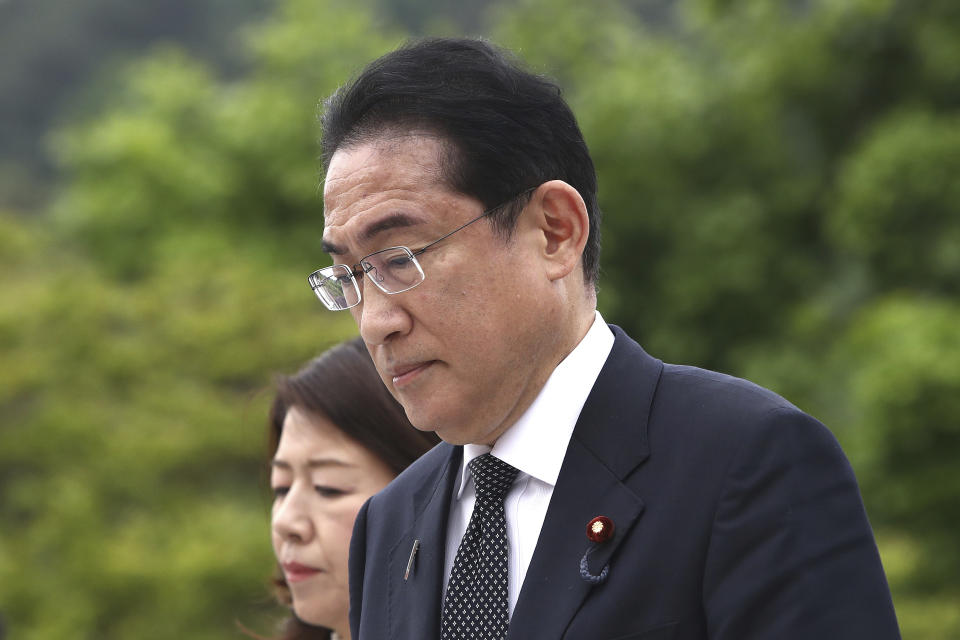 Japanese Prime Minister Fumio Kishida and his wife Yuko arrive at National Cemetery in Seoul, South Korea Sunday, May 7, 2023. The leaders of South Korea and Japan are to meet Sunday for their second summit in less than two months, as they push to bolster cooperation following years of fraught ties over historical issues. (Chung Sung-Jun/Pool Photo via AP)