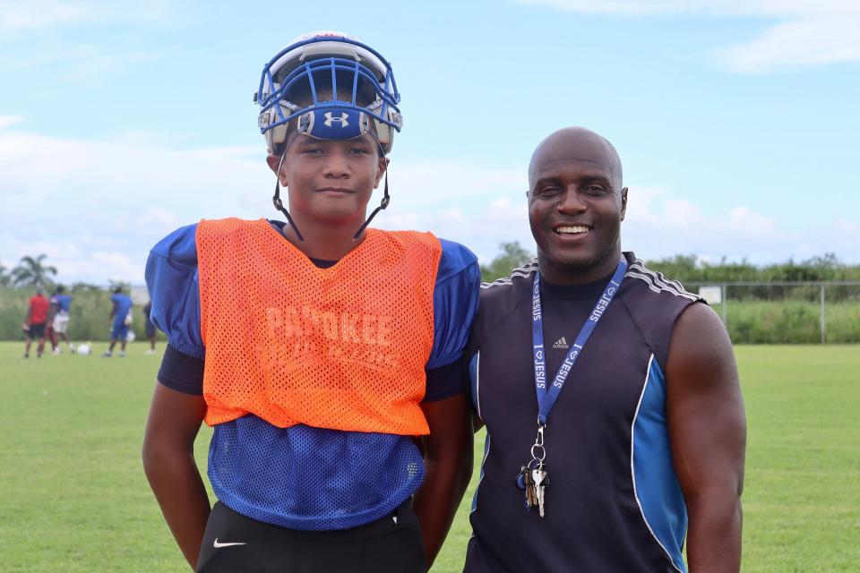 Pahokee quarterback Austin Simmons and his father, David Simmons.