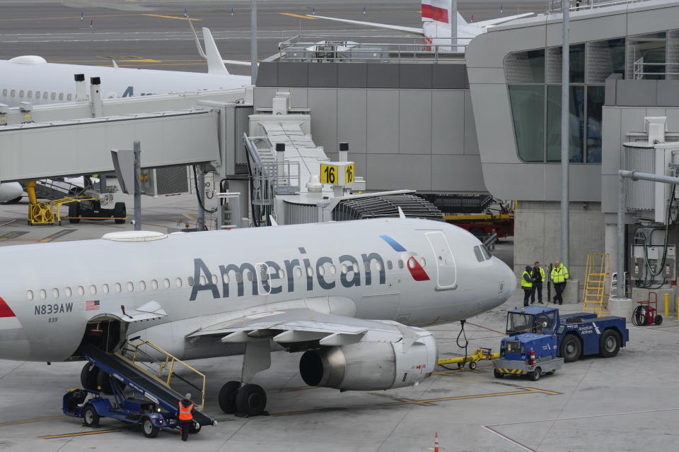 FILE - American Airlines planes sit on the tarmac at Terminal B at LaGuardia Airport in New York, Wednesday, Jan. 11, 2023. American Airlines gave more proof Thursday, Jan. 26, of the recovery in air travel, posting a better-than-expected profit for the fourth quarter. (AP Photo/Seth Wenig, File)