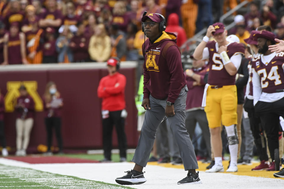 Minnesota running backs coach Kenni Burns, now associate head coach, watches the team during the first half of an NCAA football game against the Bowling Green Falcons on Sept. 25, 2021, at Huntington Bank Stadium in Minneapolis, Minn. Kent State has agreed to hire Burns to replace Sean Lewis, who left after five seasons, a person familiar with the deal confirmed to The Associated Press. The person spoke to the AP on condition of anonymity Wednesday, Dec. 14, 2022, because the schools had not announced the move. (Aaron Lavinsky/Star Tribune via AP)