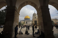 Muslims gather for Friday prayer, next to the Dome of the Rock Mosque in the Al Aqsa Mosque compound in Jerusalem's old city, Friday, Nov. 6, 2020. The Palestinian leadership has condemned the United Arab Emirates' decision to forge ties with Israel as a "betrayal," but it could lead to a tourism bonanza for Palestinians in east Jerusalem as Israel courts wealthy Gulf travelers. (AP Photo/Mahmoud Illean)