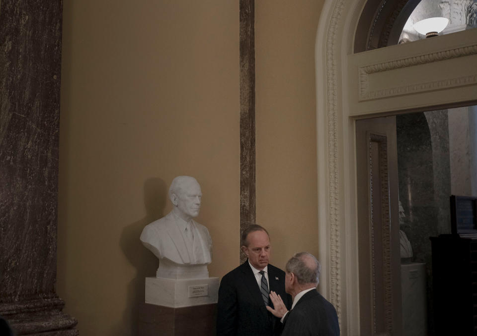 Sen. Jim Risch (R-Idaho) has a private conversation with White House legislative affairs director Eric Ueland off the floor of the senate before the impeachment trial at the Capitol in Washington, D.C., on Jan. 24, 2020. | Gabriella Demczuk for TIME