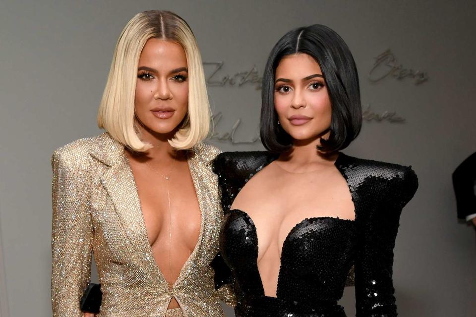 <p>Kevin Mazur/Getty Images</p> Khloé Kardashian and Kylie Jenner in 2019