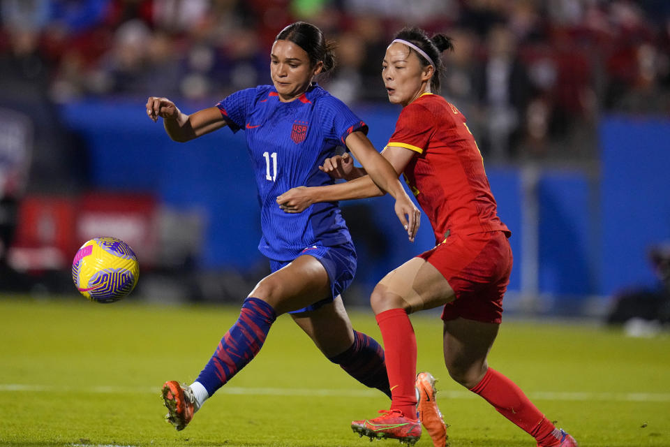 United States' Sophia Smith, left, attacks against China's Li Mengwen during the second half of a women's international friendly soccer match, Tuesday, Dec. 5, 2023, in Frisco, Texas. (AP Photo/Julio Cortez)