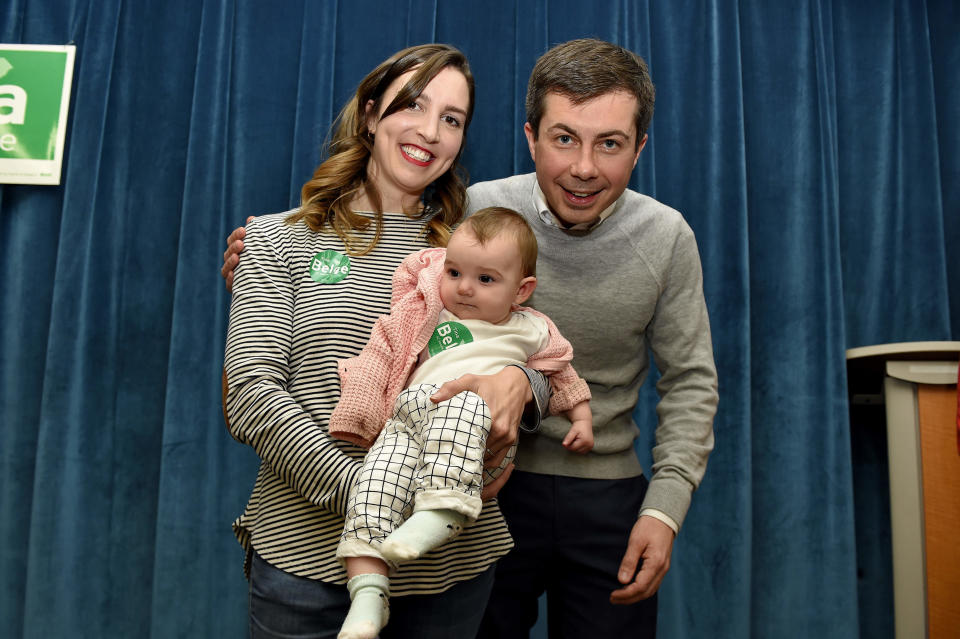 South Bend Mayor Pete Buttigieg poses for a photo with Tina Belge and her daughter 7-month-old Sammy Pocta after speaking to a crowd during the Democratic monthly breakfast at the Circle of Friends Community Center in Greenville, S.C. Buttigieg was the longest of long shots when he announced a presidential exploratory committee in January. But now the underdog bid is gaining momentum, and Buttigieg can feel it. (AP Photo/Richard Shiro)