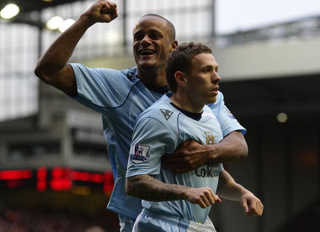 Kompany (left) played alongside Bellamy at City