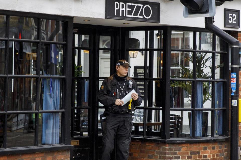 Officers outside the Prezzo restaurant in Salisbury (EPA)