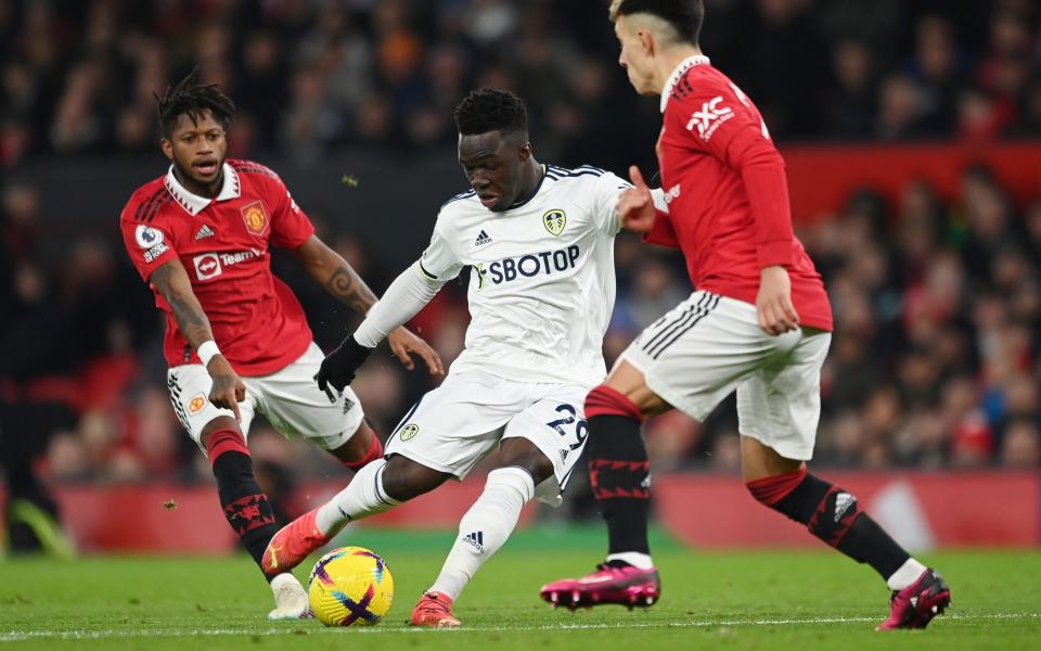 Wilfried Gnonto of Leeds United scores the team's first goal during the Premier League match between Manchester United and Leeds United - Michael Regan/Getty Images