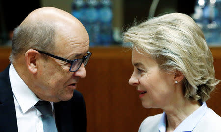 France's Defence Minister Jean-Yves Le Drian (L) and his German counterpart Ursula von der Leyen attend a European Union foreign and defence ministers meeting in Brussels, Belgium November 14, 2016. REUTERS/Yves Herman