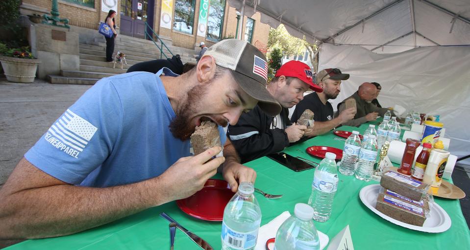 Craven Walden takes part in the Liver Mush Eating Contest during the Mush, Music and Mutts Festival held Saturday, Oct. 15, 2022, at Court Square in Uptown Shelby.