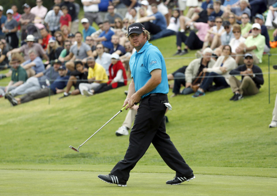 William McGirt walks away after missing a birdie putt on the 18th green in the third round of the Northern Trust Open golf tournament at Riviera Country Club in the Pacific Palisades area of Los Angeles, Saturday, Feb. 15, 2014. (AP Photo/Reed Saxon)